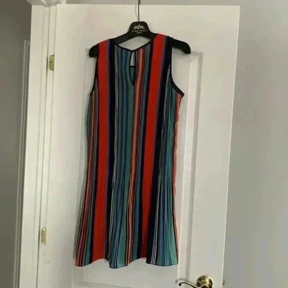 Beautiful vibrant colours summer dress. Very light.  Has a flare in the bottom